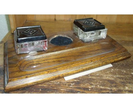 Oak inkwell with glass inkwells and bakelite tops 