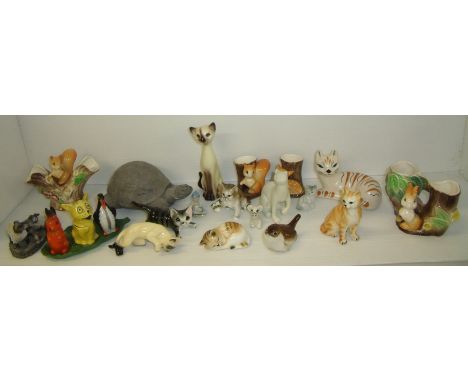 Selection of ceramic animals including Wade pixie, bisque condiment set, Lomonosov bird, Dandykat etc.