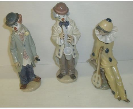 Two Lladro clowns, one playing the saxophone & one playing the violin and a Nao figurine in clown costume with a lute