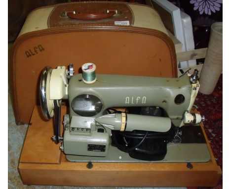 Vintage Alfa electric sewing machine with controls in original case