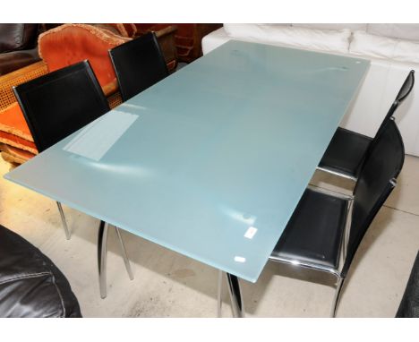 Large glass topped dining table with four chairs 