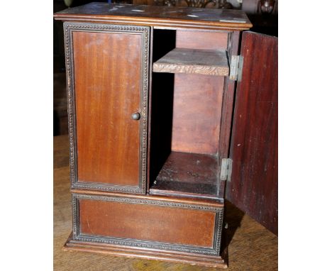 Small mahogany table cabinet with two panelled doors above single cupboard 