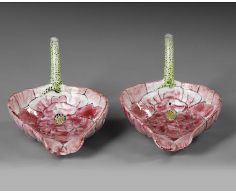 Each modeled in the shape of a large lotus blossom with incised overlapping petals outlined in black enamel and filled with s