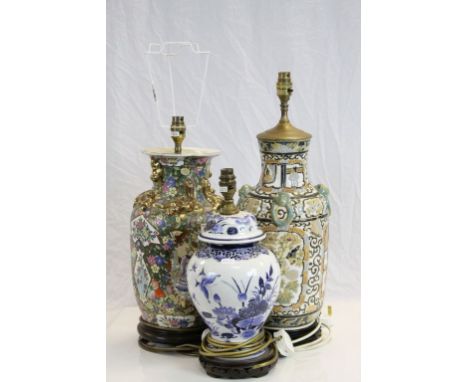 Three Oriental Ceramic Table Lamps. on Wooden Stands, tallest 45cms high