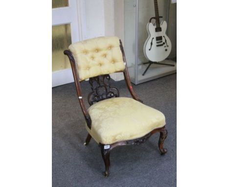 Victorian Walnut Salon Chair with Upholstered Button Back and Stuffed Over Seat, Ornately Carved Splat and raised on Cabriole