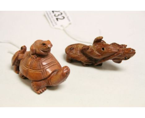 Two wooden netsuke figures to include tortoise with frog and mouse carrying tortoise 