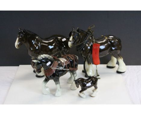 Four vintage Ceramic Shire Horses, two with blurred makers marks to underside, largest horse approx 30.5cm tall