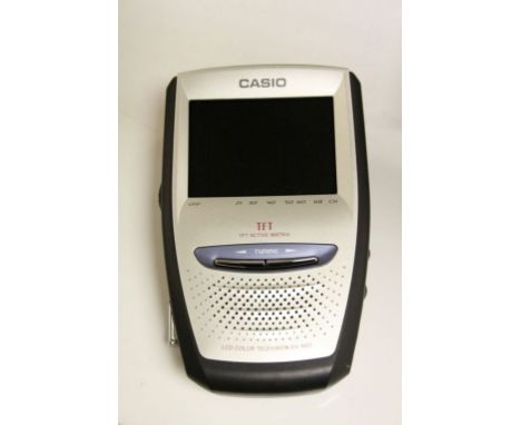 Boxed vintage Casio Portable Colour TV with 3" screen, model EV-660 plus an in car Charger