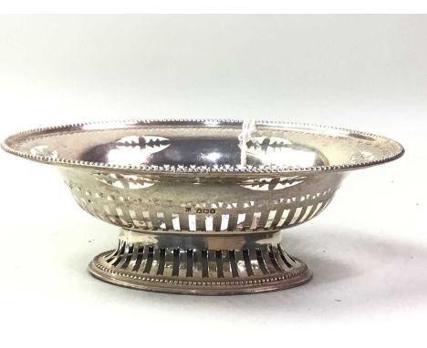 SILVER BON BON DISH, AND OTHER SILVER ITEMS  the bon bon dish of oval form, along with a cream jug, pill box and caddy spoonQ