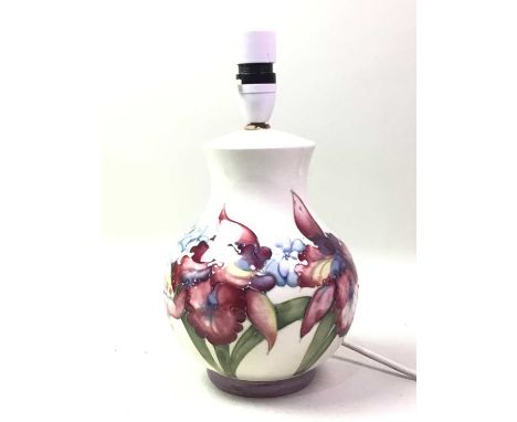 MOORCROFT LAMP, decorated with flowers, all on a white ground, bearing part label and marks to base28cm high