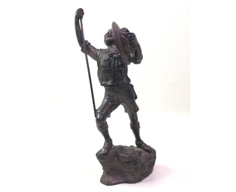 BRONZE FIGURE, modelled as a hiker, on naturalistic ground28.5cm high 