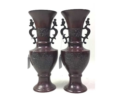 PAIR OF JAPANESE BRONZE VASES, EARLY / MID 20TH CENTURY with twin handles, decorated with foliage and birds,25.5cm high 