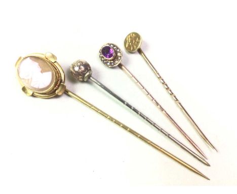 STICK PIN, NINE CARAT GOLD set with amethyst and seed pearl, along with three other stick pinsQty: 4