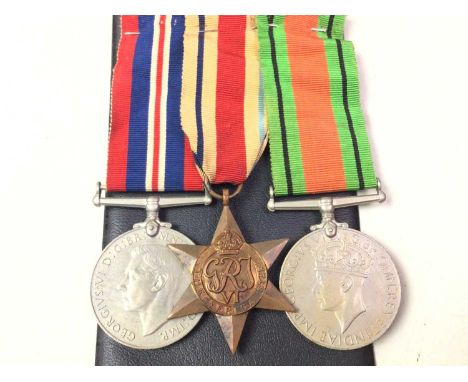 WWII MEDAL TRIO, ALONG WITH A COLLECTION OF COINS  the medals comprising the Defence Medal, the War medal and Africa star, al