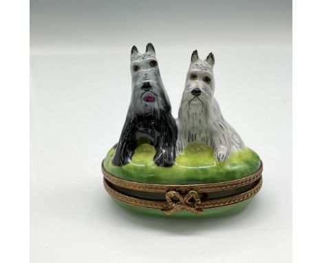 Box depicts a pair of black and white terriers sitting in grass. Bronze colored metal band, hinged closure with ribbon clasp.