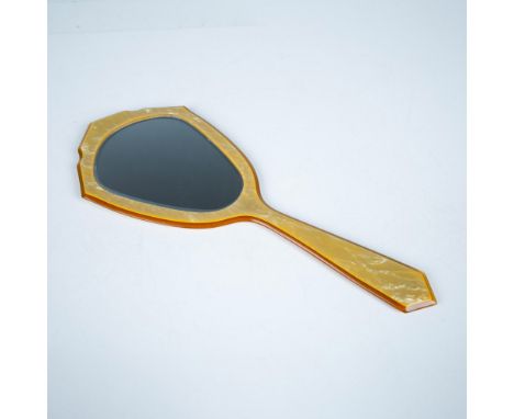 Golden-colored celluloid mirror with orange topaz rhinestones. Carleton Arch Amerith engraved marking on the front. Issued: 1