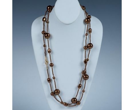 Unique multi sized faux pearls create this necklace in a beautiful bronze color. The tiny pearl like bronze beads are separat