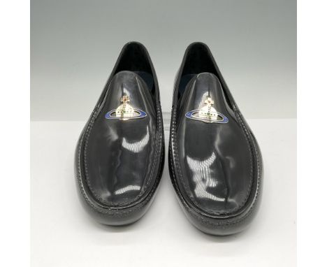 Black patent leather slip on with gilt cross and blue ring emblem. Rubberized sole. Vivienne Westwood mark. This item has its