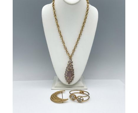 This charming grouping features an Irish etched purple crystal pendant accompanied by a gold-toned chain, a Monet moon pin si