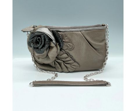 Zippered top closure opens to fabric lining and additional zippered pockets. Grey-Bronze colored leather exterior with leathe