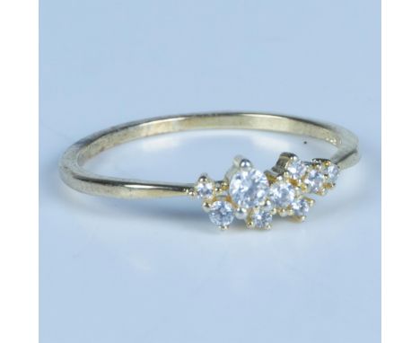 Beautiful gold tone sterling silver ring set with white zircon stones. It is marked S925 inside the band. Size 8.75. Dimensio