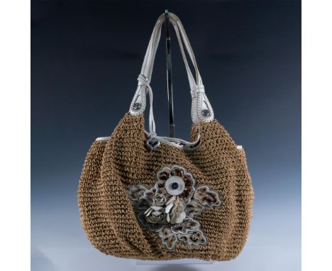 Natural woven fiber with pearlescent leather, leather flower medallion and accented by animal print design. Leather shoulder 