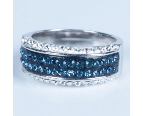 This beautiful ring is sterling silver set with small blue and clear crystals. It is stamped 925 inside the band. Size 7.25. 
