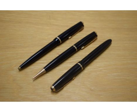 A Parker Slimfold aerometric fill fountain pen, Duofold Ballpoint pen , and a Duofold Propelling pencil all in black with dec