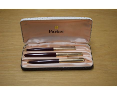 A boxed Parker 51 aerometric fountain pen, propelling pencil and ballpoint pen in Maroon with Rolled Gold cap