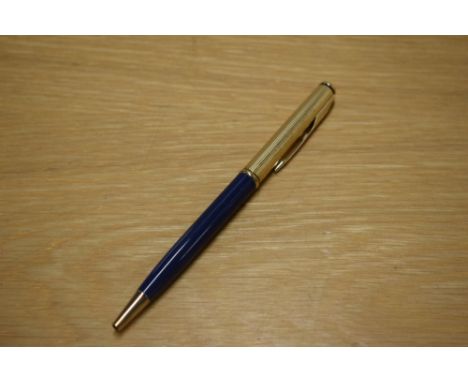 A Parker 75 Insignia ballpoint pen in in blue with custom gold plated cap