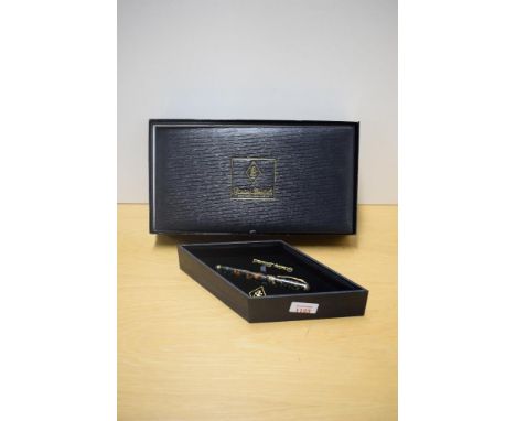 A boxed Conway Stewart Raleigh converter fill  fountain pen in Pistachio No633/042 with four narrow cap bands having a Conway