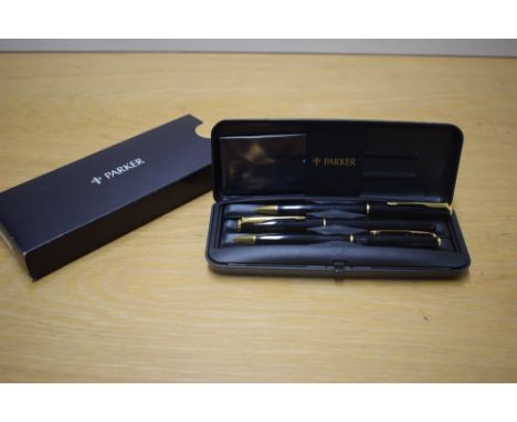 A boxed Parker Sonnet converter fill fountain pen, propelling pencil and ballpoint pen set in Laque black with gold trim havi