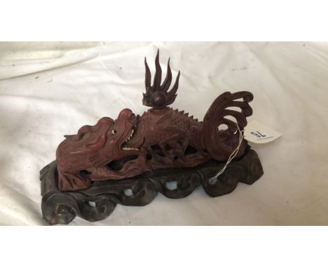  Sale Item:    SMALL WOODEN DRAGON ON STAND(AF)   Vat Status:   No Vat   Buyers Premium:  This lot is subject to a Buyers Pre