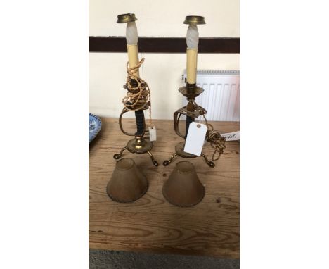  Sale Item:    2 BRASS SWORD LAMPS   Vat Status:   No Vat   Buyers Premium:  This lot is subject to a Buyers Premium of 15% +