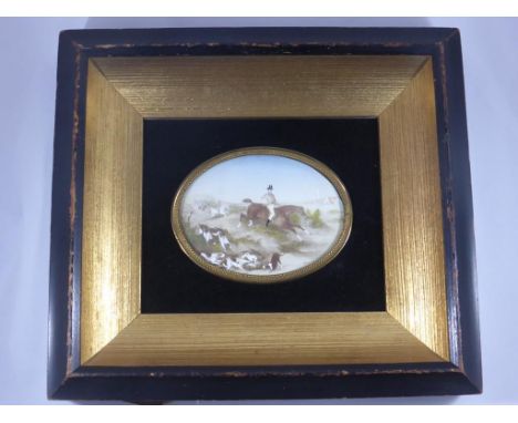 OVAL MINIATURE IN FRAME DEPICTING A PRIMITIVE HUNTING SCENE WITH INDISTINCT SIGNATURE