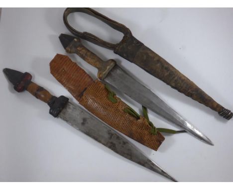 2 AFRICAN KNIVES, ONE WITH HIDE SCABBARD THE OTHER WITH SNAKESKIN, APPROX. 30cm