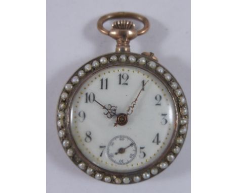 CONTINENTAL GOLD CASED LADIES FOB WATCH WITH SEED PEARL SURROUND AND RED ENAMELLED CASE BACK