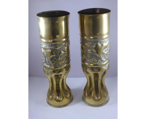 TRENCH ART, A PAIR OF DECORATED ARTILLERY SHELLS, APPROX. 27 cm