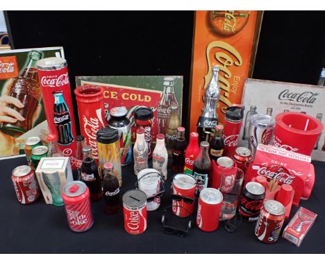 A COLLECTION OF COCA-COLA MEMORABILIAincluding a pair of braces, a handbag, a diner cruet stand, dancing cans, bottles, inclu