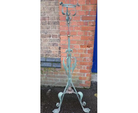 AN ART NOUVEAU BRASS AND IRON STANDARD LAMP BASEadjustable height (iron parts painted green)