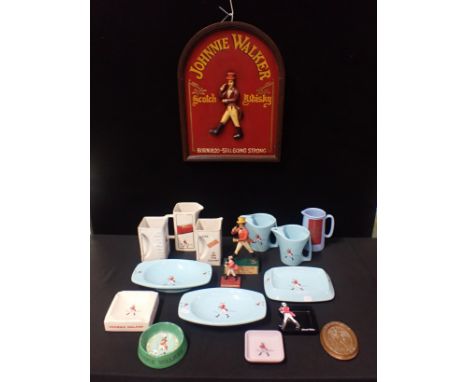 A COLLECTION OF JOHNNIE WALKER ADVERTISING ITEMSincluding Wade jugs and ashtrays, plastic figures and other items