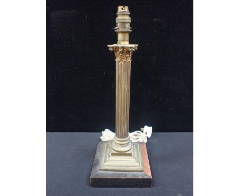 A BRASS CORINTHIAN COLUMN STYLE LAMP(untested, piece of moulding missing from base)