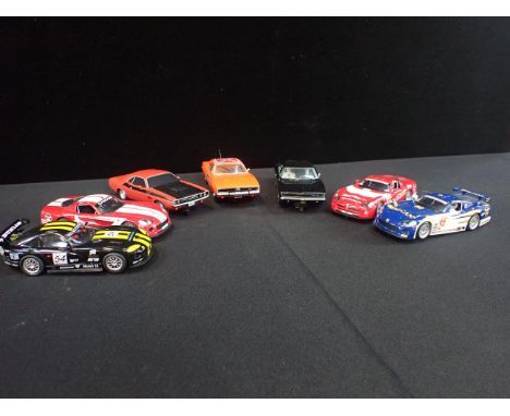 SEVEN UNBOXED SCALEXTRIC 'DODGE' CARS including the 'Dukes of Hazards' 'General Lee'. Some shown signs of light use but good 