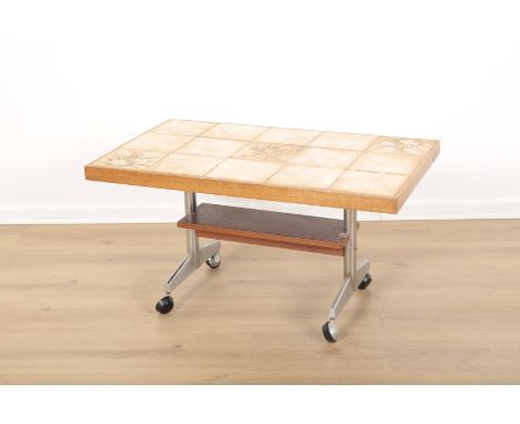 A MID CENTURY TEAK AND CHROMED METAL COFFEE TABLEwith floral tile top, low under tier on tubular legs and casters, 40cm high 
