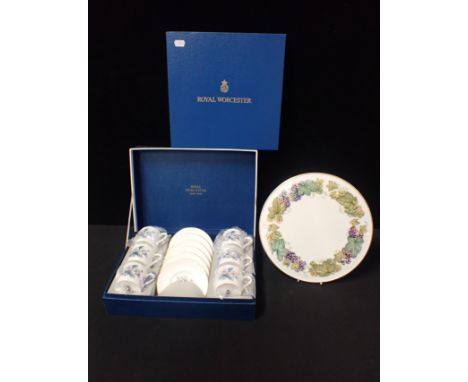 A ROYAL WORCESTER BOXED COFFEE SERVICEwith a Royal Worcester boxed cake plate; 'Vine Harvest' design. (2)