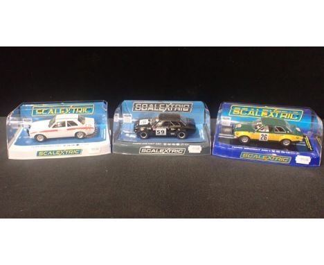THREE BOXED SCALEXTRIC 'FORD ESCORT MK1' CARSall boxed and in good condition. Including C3748 Ford Escort 'Crystal Palace 197