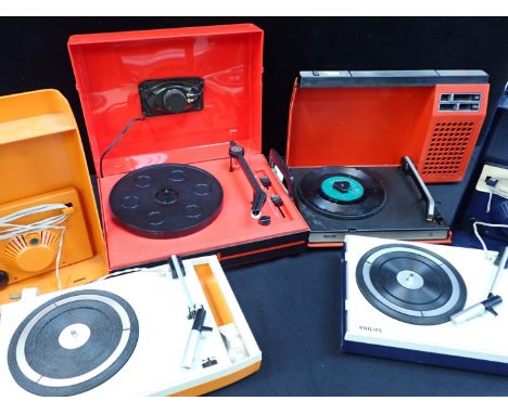 THREE VINTAGE PHILIPS PORTABLE RECORD PLAYERSin plastic cases, c.1970s, and a similar GDR manufactured 'pop Sound' record pla