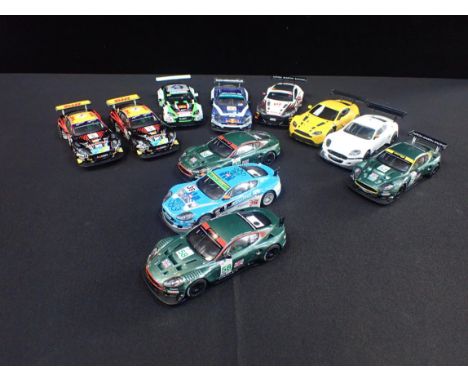 ELEVEN UNBOXED SCALEXTRIC 'ASTON MARTIN' RACE CARS&nbsp;Different styles and designs. Some shown signs of light use but good 