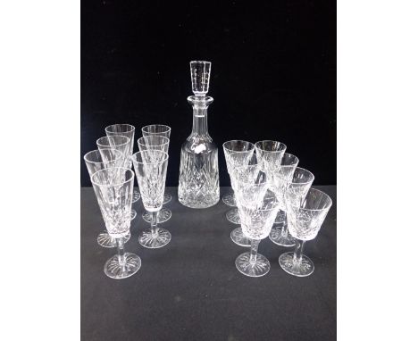 SEVEN WATERFORD 'LISMORE' CHAMPAGNE FLUTESeight matching wine glasses (14.5cm), and a decanter
