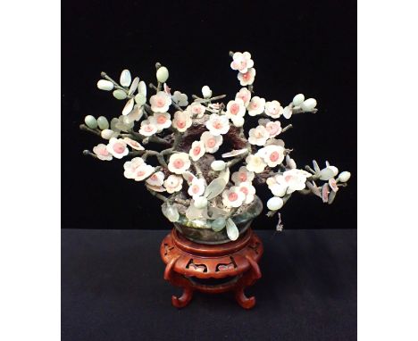 A CHINESE 'JADE TREE', IN TURNED POTand on wooden stand 35cm high overall